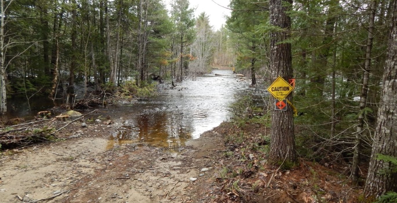 751 2019 05 02 5 5 lot flood at swale before rocks on road
