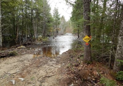 751 2019 05 02 5 5 lot flood at swale before rocks on road