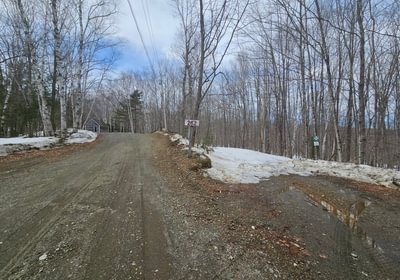 905 Driveway entrance with Gallup Road to right